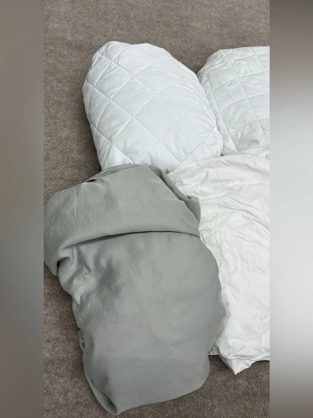 Assorted twin sheets and mattress protectors